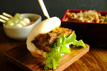 Hirata buns.  Japanese steamed buns filled with pork chashu, tempura, karaage. Japanese traditional food