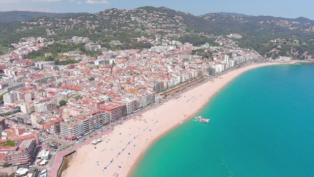Lloret de Mar, Spain: Aerial view of resort town on Costa Brava near Barcelona, Lloret Beach (Platja de Lloret de Mar), clear waters of Mediterranean Sea - landscape panorama of Europe from above