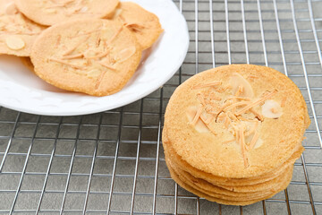 Almond crispy cookies with grated cheese, thin texture
