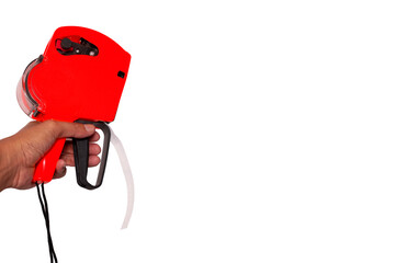 Hand holding red shop pricing gun isolated on a white background. Copy space