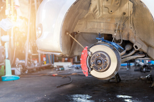 Car disk brake repair in garage, Wheel brake system problem, car safety