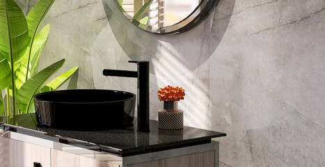 Realistic 3D render modern black ceramic washbasin with faucet on a granite vanity countertop in a bathroom with morning sunlight. Blank space for products display mockup, Background, Decor plants. - obrazy, fototapety, plakaty