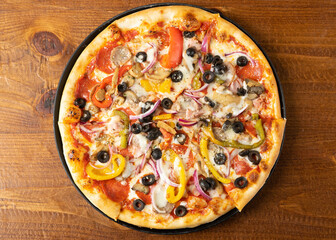 Pizza with peppers, onions and olives