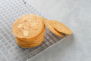 Almond crispy cookies with grated cheese, thin texture

