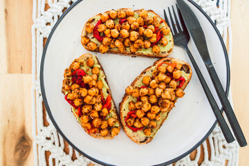 healthy plant-based food, vegan avocado toast with bell pepper and spicy chickpeas