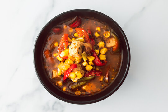 healthy plant-based food, vegan bell pepper corn and tofu soup with spicy broth