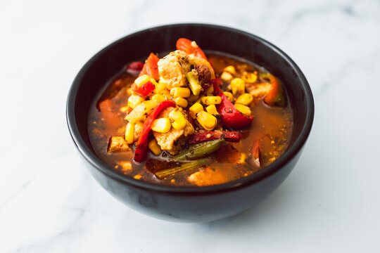 healthy plant-based food, vegan bell pepper corn and tofu soup with spicy broth