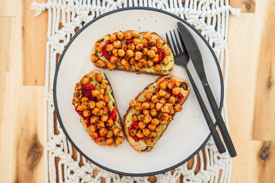 healthy plant-based food, vegan avocado toast with bell pepper and spicy chickpeas