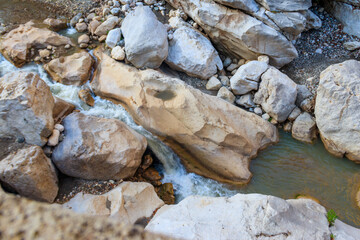 Scenic landscape with beautiful mountain brook. Idyllic scenery with clear water in small river. Fast water flow close-up