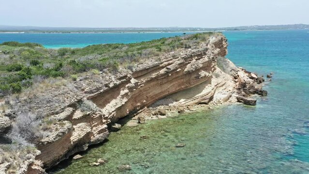 Rugged Cliff With Vegetation In Isla Cabra, Montecristi, Dominican Republic. aerial