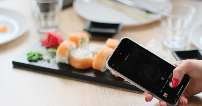 taking pictures of sushi on the phonefish