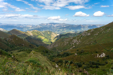 spectacular mountain scenery full of vegetation with a blue sky, somewhat overcast