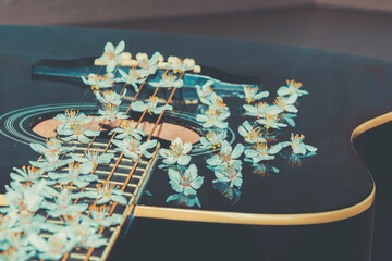 Musical instrument in colors. Romantic guitar. Melodic instrument with flowers