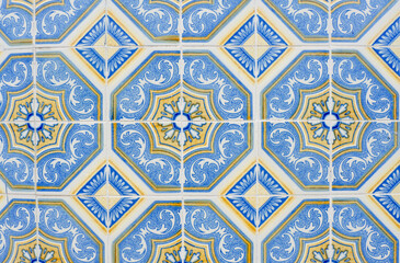 Traditional vintage tiles on the wall outside in downtown district in Porto, Portugal
