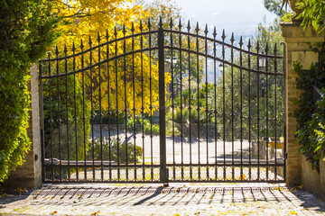 Forged metal gate to the garden of love. Secret Garden.