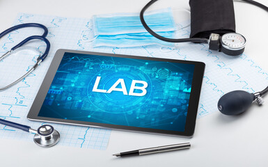 Close-up view of a tablet pc with medical abbreviation
