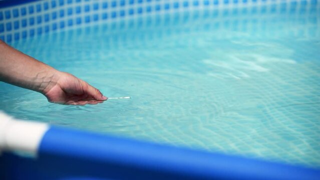 Strip for testing water for chlorine, ph in the home swimming pool. Home pool care