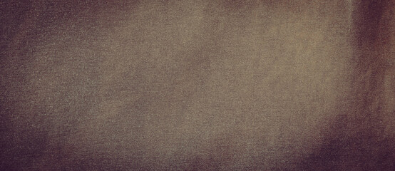 defocused abstract background of brown  fabric with vintage grunge background texture with black scuffed edges and old faded antique design has copy