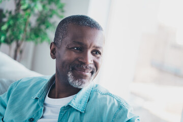 Portrait of handsome aged man looking copyspace away enjoy holidays in modern house apartment