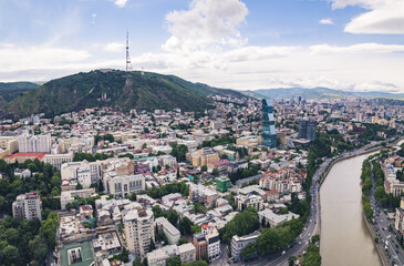 Fototapeta premium scenic drone shot of Tbilisi center and Mtatsminda TV mast, Georgia, Europe. High quality photo
