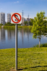 there is a sign on the grass forbidding picking plants
