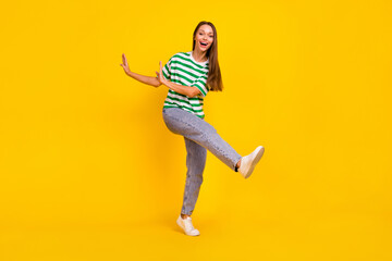 Full body photo of charming satisfied person enjoy dancing partying isolated on yellow color...