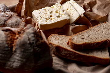 goat or sheep cheese and bread on the table