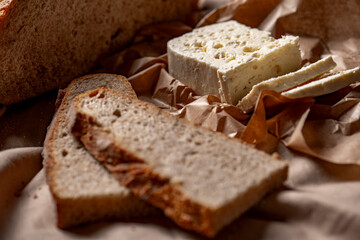goat or sheep cheese and bread on the table