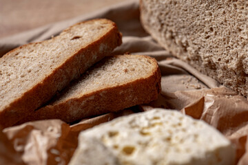 goat or sheep cheese and bread on the table