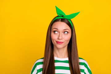 Photo of pretty minded person look interested empty space wonder guess isolated on yellow color...