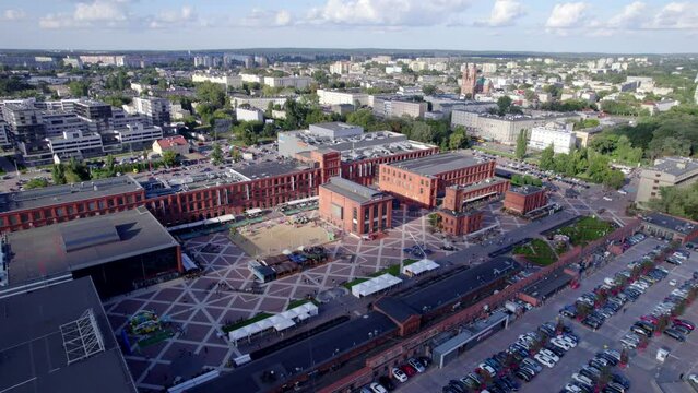 Ł&oacute;dź city on a sunny day. Characteristic places, buildings and streets. Piotrkowska Street from the bird's eye view.