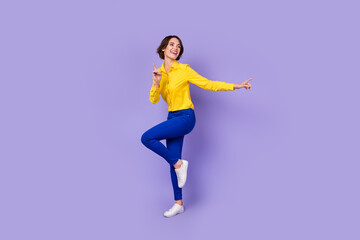 Fototapeta na wymiar Full size photo of funny millennial lady dance look empty space wear smart casual isolated on violet background