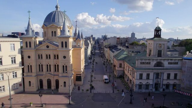 Ł&oacute;dź city on a sunny day. Characteristic places, buildings and streets. Piotrkowska Street from the bird's eye view.