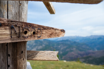 Hiking trail sign post at summit of mountain in the Alps