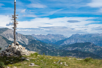 Hiking trail sign post at summit of mountain in the Alps