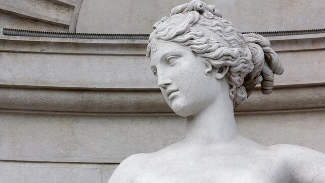 Close-up of the beautiful face of the statue of Venus on the facade of the Lloyd palace in Trieste, Italy