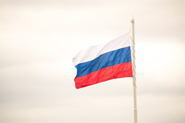 Flag of Russia on the background of a clear sky on the street. Place for copy space text mocap. Place for your text, copy space. Concept: peace and prosperity