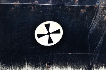The painted sign of the thruster on board the ship