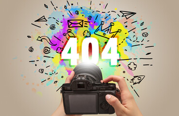 Close-up of a hand holding digital camera with abstract drawing