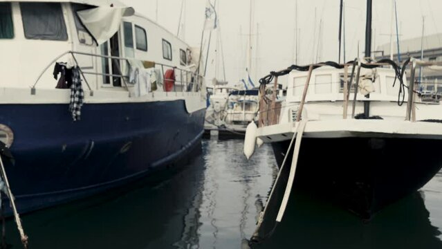 Sailing between yachts in Jaffo Tel Aviv port 4K