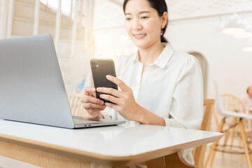 woman work using texting cell phone typing computer.student study education online learning.adult professional chatting on laptop,mobile contact us at Thinking business plan.connecting people concept