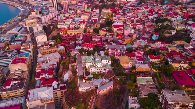 Aerial hyperlapse of Baburizza Palace, Yugoslavian Walk and El Peral funicular in Cerro Alegre, Sea Port in the back, Valparaiso, Chile