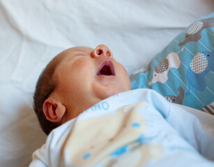 Detail of the mouth of a newborn while yawning. Selective focus on the mouth to accentuate the...