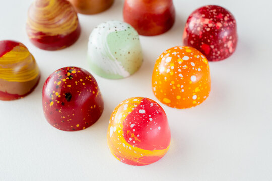 Assortment of painted chocolate pralines. Handcrafted bonbons.Delicious dessert.