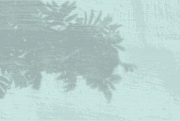 Natural light casts shadows from a leaves branches of tree. Top view of the shadow of tree leaves on a textured blue colored background. He was lying flat