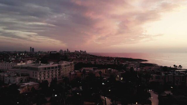 Epic drone shot getting up above old Jaffo at sunset 4K