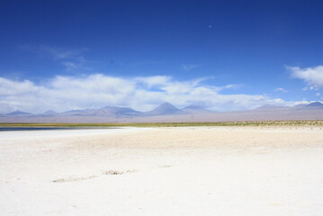 Salt lagunas and volcanos and red rocks southern from San Pedro de Atacama. Stunning scenery at Atacama desert, Chile, South America