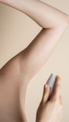woman with antiperspirant spray