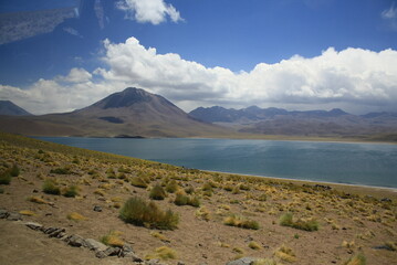 Salt lagunas and volcanos and red rocks southern from San Pedro de Atacama. Stunning scenery at Atacama desert, Chile, South America