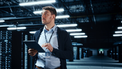 Successful Data Center IT Specialist Using Tablet Computer. Server Farm Cloud Computing Facility...
